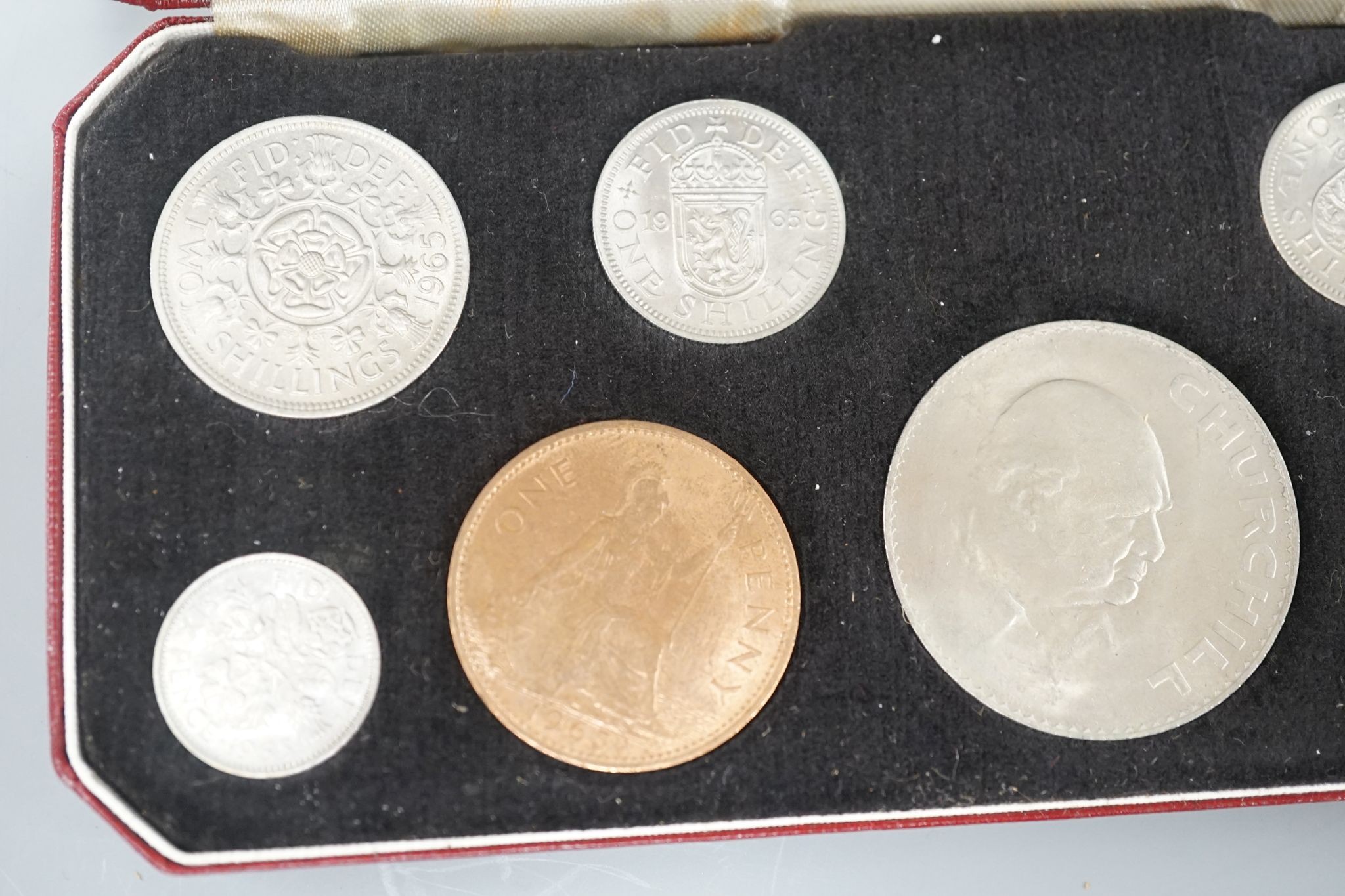 A Royal Mint Queen Elizabeth II cased set of coronation year coins 1953, UNC and a 1965 UNC set